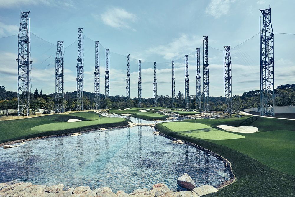 Edmonton Synthetic grass golf course with water and tall metal towers