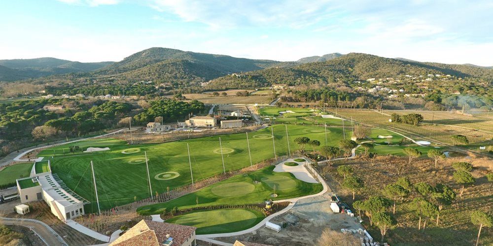 Edmonton Aerial view of a synthetic grass golf course surrounded by hills