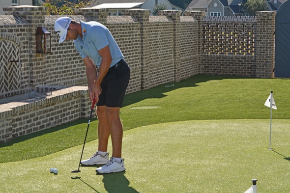 Edmonton Golfer putting on synthetic grass
