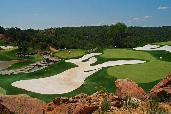 Edmonton lush green synthetic grass golf course with white sand bunkers and blue sky